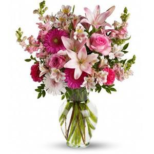 Mixed flowers in pink tones, including roses, lilies and more in Trinidad Tobago.